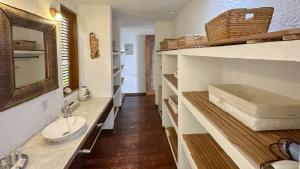 a bathroom with a sink and a toilet in it at Hotel Acantilado de La Tierra by On vacation in San Andrés +35 photos