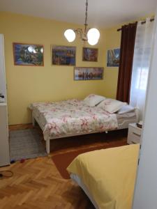 a bedroom with two beds in a room at Apartments Vučinović in Tivat