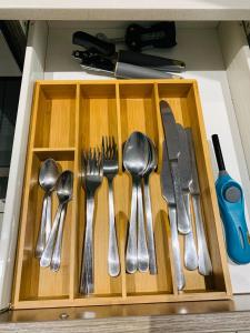 a drawer filled with utensils in a kitchen at The Bridge at Montego in Fourways