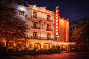 a hotel building with a neon sign in front of it at Hotel Florence Inn, Karol Bagh, New Delhi, 2 Min from Metro in New Delhi