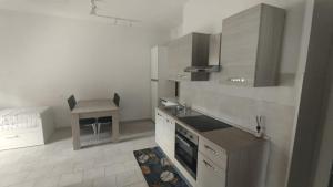 a kitchen with a sink and a stove top oven at Leo's Villa in Milano Marittima