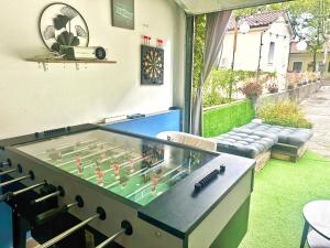a large ping pong table in the middle of a yard at Das Hostel Rijeka in Rijeka