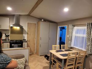 a kitchen and dining room with a table and chairs at 181 northfield in Skipsea