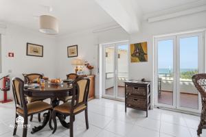 a dining room with a table and chairs at BC Beach House - Santa Cruz in Santa Cruz