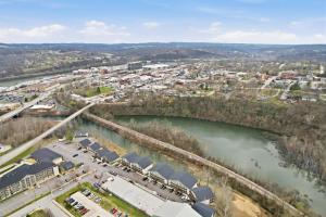 an aerial view of a town next to a river at Serene Creek Condo Pool & Gym in Branson +22 photos