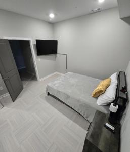 a bedroom with a bed with a yellow pillow at Immaculate Vibes Sunset View Condo in Birmingham