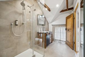 a bathroom with a shower and a sink at MEL&BENS Altstadt Suites mit Parkoption in Celle +114 photos