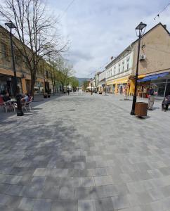 an empty street in a town with buildings at Stan na dan bb in Bajina Bašta