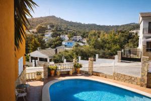 a villa with a swimming pool and a view at VIP private Poolsuite Calafell in Calafell