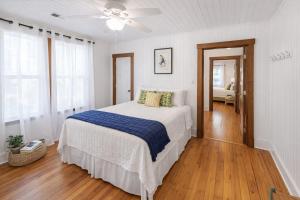 a bedroom with a bed and a ceiling fan at Cabin in Tybee Island, Georgia in Tybee Island