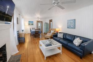 a living room with a couch and a table at Cabin in Tybee Island, Georgia in Tybee Island
