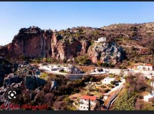 a small town on a hill with a mountain at Mulberry Tree Cottage Episkopi Paphos in Episkopi Pafou +7 photos