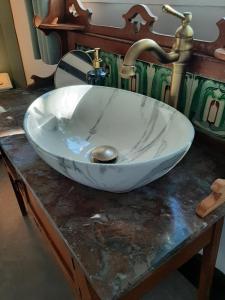 a sink with a faucet on top of a table at Mulberry Tree Cottage Episkopi Paphos in Episkopi Pafou