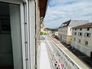 a view of a city street from a window at Le Vinois Climatisation 2 chambres balcon in Vinay