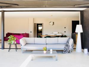 a living room with a couch and a table at Lux CostaBravaSi in Platja d'Aro