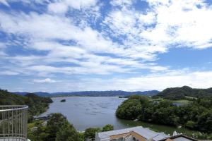 a view of a river with boats in the water at Resorpia Kumihama in Kyotango