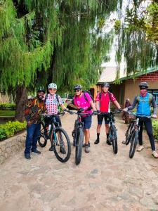 a group of people standing with their bikes at Bright Michelle Homestay in Lushoto +40 photos