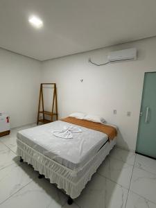 a bedroom with a bed in a room at pousada palmeiras bhs in Barreirinhas +44 photos