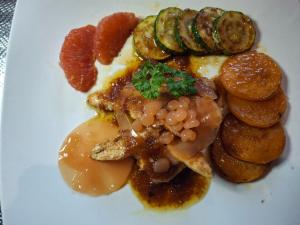 a white plate of food with beans and vegetables at Maison 3 chambres privées in Sérignan +29 photos