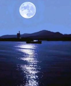 a full moon rising over a body of water at Ela addara Home stay in Lukasgoda +11 photos