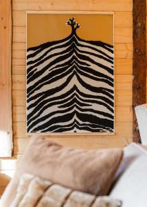 a picture of a zebra print on a wall at Tupa Lodge by The Guide Father in Rovaniemi
