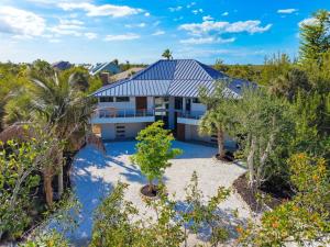 an aerial view of a house with palm trees at Bentley Beach House in Sanibel