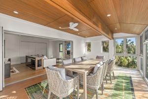 a dining room with a table and chairs at Bentley Beach House in Sanibel