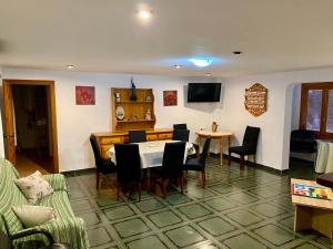 a living room with a table and chairs at Retiro Gastro-Rural in Moratalla