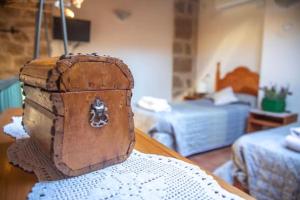 an old trunk sitting on top of a table at Casa Tomás in Calaceite