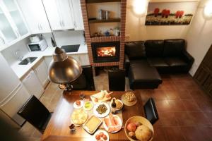 a living room with a table and a fireplace at Casa Tomás in Calaceite