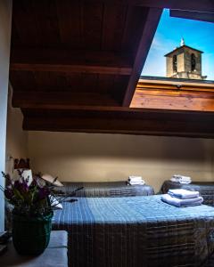 a room with a table with a view of a building at Casa Tomás in Calaceite