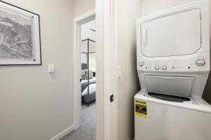 a kitchen with a washer and dryer in a room at 103 Granby Meadow Dr in Granby