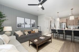 a living room and kitchen with a couch and a table at 103 Granby Meadow Dr in Granby