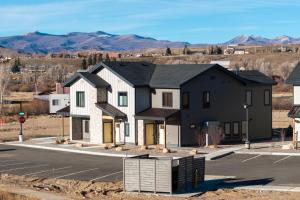 a rendering of a house with a parking lot at 103 Granby Meadow Dr in Granby