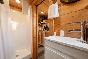 a bathroom with a sink and a shower at Sojourn Lodging in Sevierville +123 photos