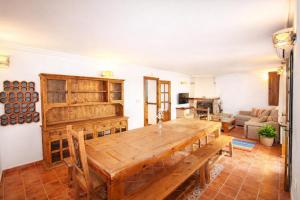 a living room with a wooden table and a couch at La Casona del Olivo - Pool, Patio, BBQ & Pet-Friendly in Torre-Pacheco +56 photos