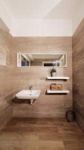 a bathroom with a sink and a mirror and a sink at Hotel Aria di Mare Bed & Breakfast & Beach in centro a Riccione in Riccione +35 photos