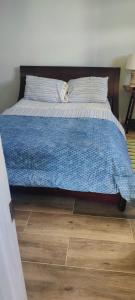 a bed with a cat laying on top of it at Ti Kai Nous in Roger