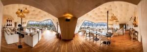 a restaurant with tables and chairs in a large room at Moreno Camp - Glamping with a view in El Calafate