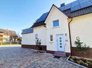 a house with solar panels on the roof at ARGENTA Living 15 in Fulda