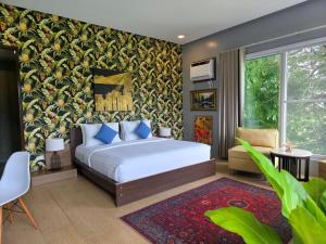 a bedroom with a bed and a colorful wall at Amazing Villa Best View in Boracay