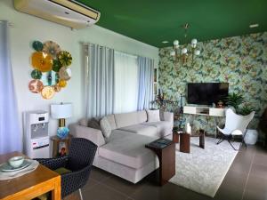 a living room with a couch and a tv at Amazing Villa Best View in Boracay