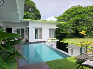 a swimming pool in front of a villa at Amazing Villa Best View in Boracay