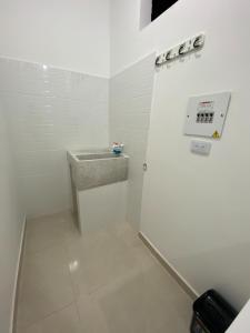 a small bathroom with a sink and a counter at Apartamento Tercer Cielo 203 in Cúcuta +26 photos