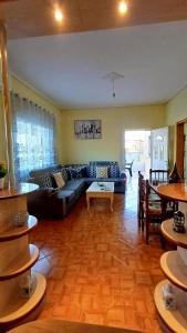 a living room with a couch and a table at Villa Albano in Delvinë +11 photos
