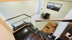 an overhead view of a living room with a couch at Chacara Stay in São Paulo