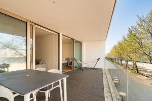 a house with a table and chairs on a balcony at Douro Porto View in Vila Nova de Gaia