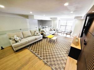 a living room with a couch and a table at Luxury House with Open Living Space in Toronto
