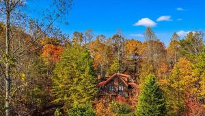 a log cabin in the middle of the forest at Getaway Cabin Loft Oasis Mountain View in Gatlinburg
