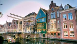 a group of buildings next to a body of water at Upstairs Stay Alkmaar in Alkmaar